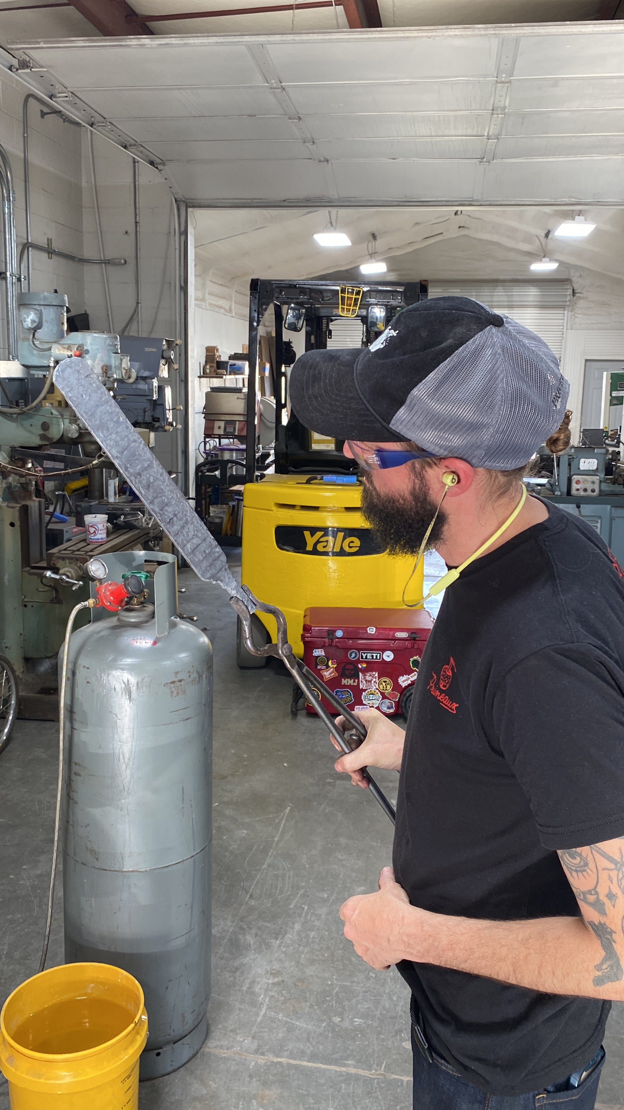 John Phillips holding a knife in the making