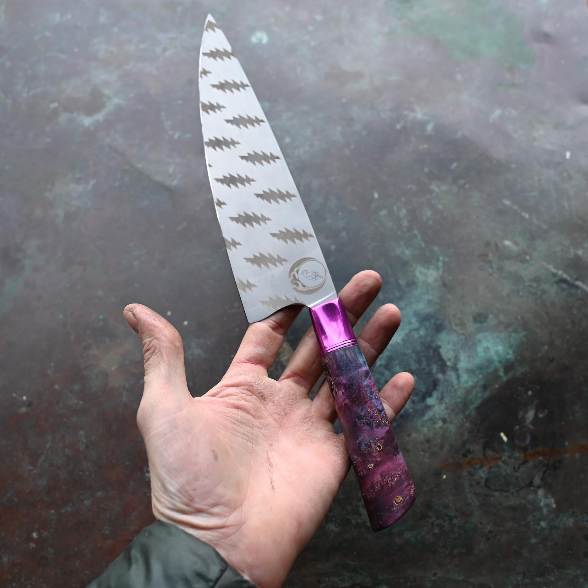 GRATEFUL DEAD CHEF KNIFE, PURPLE BOLSTER, TIE DYE WOOD HANDLE, ON CONCRETE